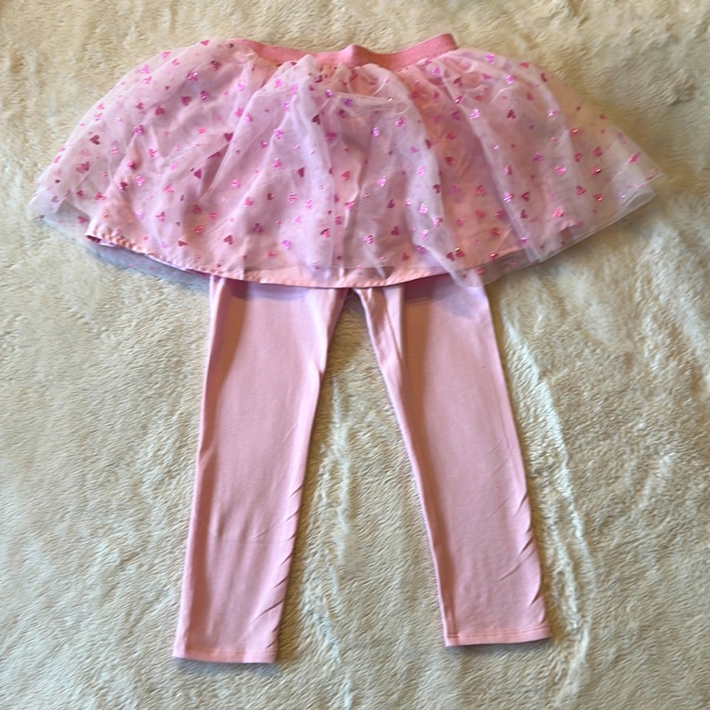 Pink pants and heart skit attached.
